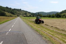 Nothing on the road and a tractor at work in a field creates a wonderful smell of cut grass Nothing on the road and a tractor at work in a field creates a wonderful smell of cut grass