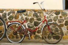 Someone's bicycle needs a bit of air in the back tire Someone's bicycle needs a bit of air in the back tire