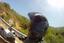 Under my helmet I'm smiling like a kid in a sweet shop Under my helmet I'm smiling like a kid in a sweet shop