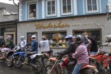 The old couple look down on the street of motorbiking madness