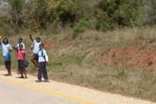 Kids wave as we ride past Kids wave as we ride past