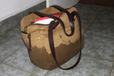 Adam's laptop bag sits in a puddle on the hotel room floor Adam's laptop bag sits in a puddle on the hotel room floor