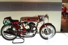 This is one well raced classic Ducati - check out the bike in back ground...